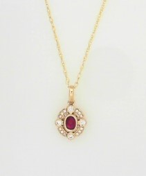 Ladies 14 Karat Yellow Gold All Colored Jewelry With 0.09Tw Round H/I Si2 Diamonds And 0.18Tw Oval Ruby Pendant with 18