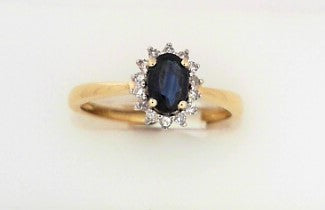 Ladies 14 Karat Yellow Gold Fashion Ring With 0.12Tw Round H/I Si2 Diamonds And 0.70Tw Oval Sapphire